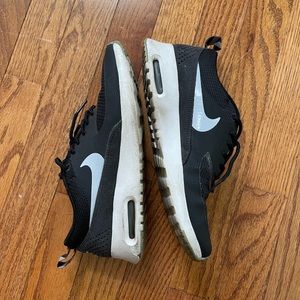 Black Nike athletic sneakers